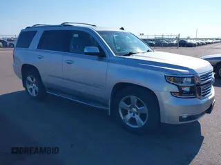 2015 Chevrolet Tahoe LTZ with VIN 1GNSKCKC5FR205739, listed as a IAAI auction lot 40020644 with 142,524 mi miles and . Bid and sale history available at DreamBid. Image 1.
