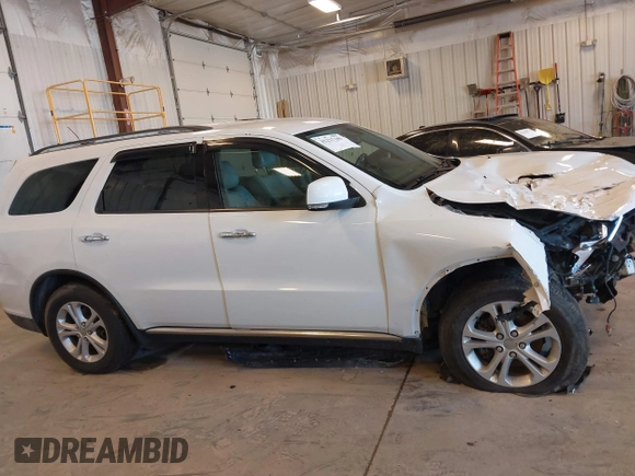 2013 Dodge Durango Crew with VIN 1C4RDHDG5DC553913, listed as a IAAI auction lot 42227189 with 209,703 mi miles and . Bid and sale history available at DreamBid. Image 13.