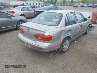 1999 Chevrolet Prizm z VIN 1Y1SK5280XZ445777, wystawiony jako IAAI lot #42138329 z przebiegiem 228 719 mil mil oraz . Historia ofert i sprzedaży dostępna na DreamBid. Obrazek 4.