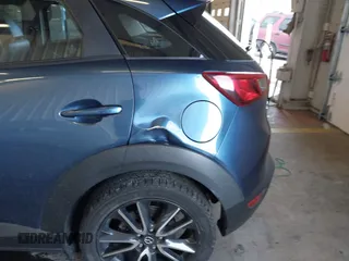 2018 Mazda CX-3 Touring z VIN JM1DKFC78J1323439, wystawiony jako IAAI lot #41725784 z przebiegiem 134 055 mil mil oraz . Historia ofert i sprzedaży dostępna na DreamBid. Obrazek 6.