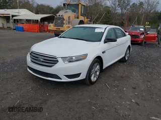 2016 Ford Taurus SE z VIN 1FAHP2D83GG131408, wystawiony jako IAAI lot #41552981 z przebiegiem 151 295 mil mil oraz . Historia ofert i sprzedaży dostępna na DreamBid. Obrazek 2.