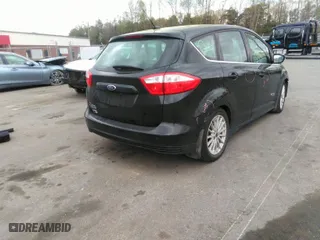 2015 Ford C-Max Energi SEL with VIN 1FADP5CU6FL110038, listed as a IAAI auction lot 41953446 with 56,097 mi miles. Bid and sale history available at carsss.com. Image 4.