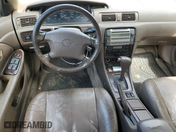 2001 Toyota Camry LE z VIN JT2BF22K610295178, wystawiony jako Copart lot #68538524 z przebiegiem 507 822 mil mil oraz Szkoda całkowita • Salvage title. Historia ofert i sprzedaży dostępna na DreamBid. Obrazek 8.