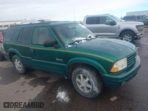 1999 Oldsmobile Bravada z VIN 1GHDT13W7X2711363, wystawiony jako IAAI lot #41294782 z przebiegiem 198 508 mil mil oraz . Historia ofert i sprzedaży dostępna na DreamBid. Obrazek 1.