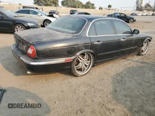 2004 Jaguar XJ with VIN SAJWA73B74TG18082, listed as a Copart auction lot 70516404 with 0 mi miles and Salvage Title. Bid and sale history available at carsss.com. Image 3.
