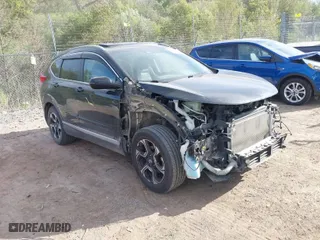 2017 Honda CR-V Touring with VIN 5J6RW2H96HL037854, listed as a IAAI auction lot 40472748 with 126,582 mi miles. Bid and sale history available at carsss.com. Image 1.