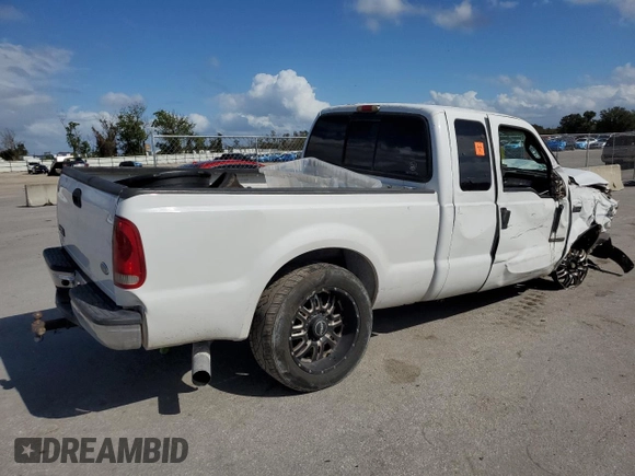 2004 Ford F-250 XL with VIN 1FTNX20PX4EA22882, listed as a Copart auction lot 79014334 with 262,447 mi miles and Salvage title. Bid and sale history available at DreamBid. Image 3.