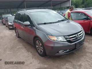 2016 Honda Odyssey Touring Elite with VIN 5FNRL5H96GB063176, listed as a IAAI auction lot 42157604 with 106,177 mi miles. Bid and sale history available at carsss.com. Image 1.