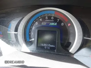 2010 Honda Insight EX with VIN JHMZE2H71AS003290, listed as a IAAI auction lot 42601332 with 163,510 mi miles and . Bid and sale history available at DreamBid. Image 7.