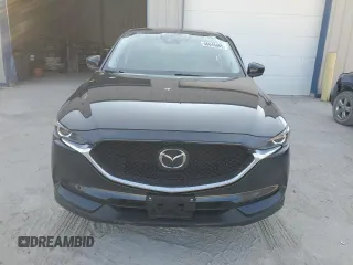 2021 Mazda CX-5 Touring z VIN JM3KFBCM5M0471172, wystawiony jako Copart lot #56646065 z przebiegiem 42 843 mil mil oraz Szkody całkowita. Historia ofert i sprzedaży dostępna na DreamBid. Obrazek 5.
