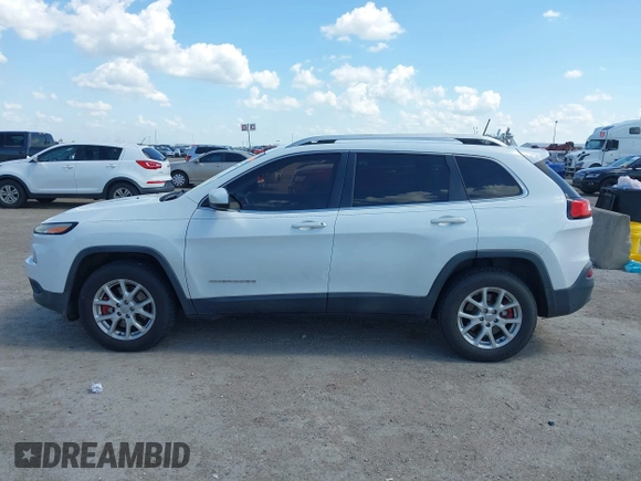 2016 Jeep Cherokee Latitude z VIN 1C4PJMCB9GW305259, wystawiony jako IAAI lot #42093050 z przebiegiem 228 747 mil mil oraz . Historia ofert i sprzedaży dostępna na DreamBid. Obrazek 14.