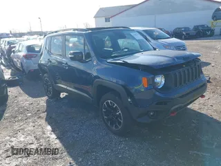 2023 Jeep Renegade Trailhawk z VIN ZACNJDC13PPP74002, wystawiony jako IAAI lot #41968140 z przebiegiem 6 848 mil mil oraz . Historia ofert i sprzedaży dostępna na DreamBid. Obrazek 1.