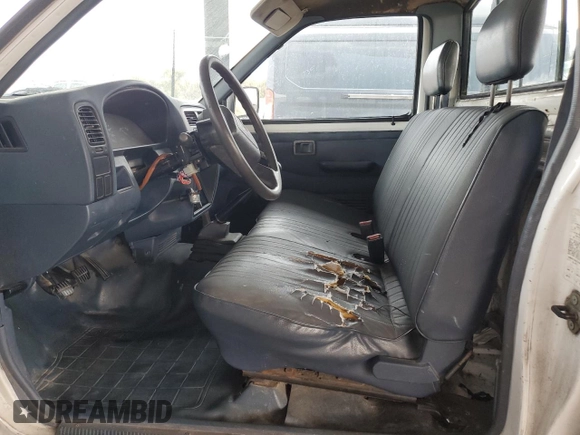 1995 Nissan Frontier with VIN 1N6SD11S3SC379478, listed as a Copart auction lot 52209415 with 21,068 mi miles and Salvage title. Bid and sale history available at DreamBid. Image 7.