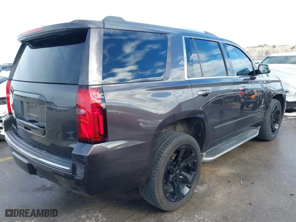 2015 Chevrolet Tahoe LTZ with VIN 1GNSCCKC8FR617540, listed as a IAAI auction lot 41356342 with 118,268 mi miles. Bid and sale history available at carsss.com. Image 4.
