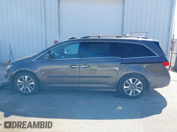2014 Honda Odyssey Touring with VIN 5FNRL5H97EB101169, listed as a IAAI auction lot 41869233 with 142,147 mi miles and . Bid and sale history available at DreamBid. Image 15.