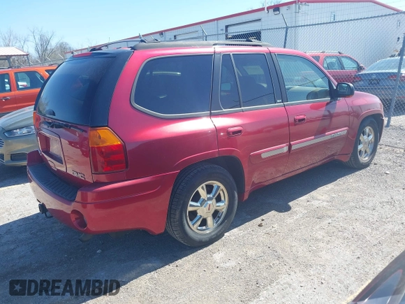 2002 GMC Envoy SLT with VIN 1GKDS13S922205147, listed as a IAAI auction lot 42041118 with 127,400 mi miles. Bid and sale history available at carsss.com. Image 4.