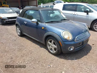 2009 MINI Convertible z VIN WMWMR33569TJ93991, wystawiony jako IAAI lot #42382783 z przebiegiem Nie podano mil oraz . Historia ofert i sprzedaży dostępna na DreamBid. Obrazek 1.
