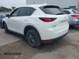2017 Mazda CX-5 Touring z VIN JM3KFBCL5H0128584, wystawiony jako IAAI lot #42354669 z przebiegiem 56 563 mil mil oraz . Historia ofert i sprzedaży dostępna na DreamBid. Obrazek 3.