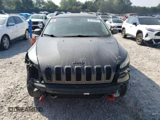 2014 Jeep Cherokee Trailhawk with VIN 1C4PJMBS1EW304718, listed as a Copart auction lot 64105485 with 151,315 mi miles and Salvage title. Bid and sale history available at DreamBid. Image 5.