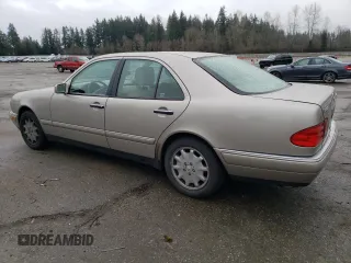 1999 Mercedes-Benz E-Class with VIN WDBJF82H2XX015586, listed as a Copart auction lot 44465455 with 76,890 mi miles and Salvage Title. Bid and sale history available at carsss.com. Image 2.