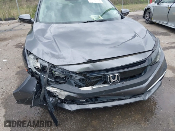 2019 Honda Civic LX with VIN 19XFC2F68KE007409, listed as a IAAI auction lot 41887406 with 57,147 mi miles and . Bid and sale history available at DreamBid. Image 6.