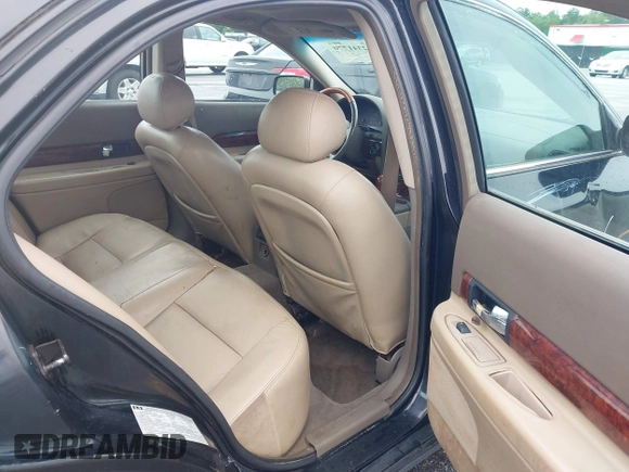 2001 Lincoln LS w/Base Pkg z VIN 1LNHM87A11Y601193, wystawiony jako IAAI lot #42341770 z przebiegiem 187 845 mil mil oraz . Historia ofert i sprzedaży dostępna na DreamBid. Obrazek 8.