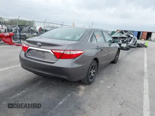 2015 Toyota Camry XLE with VIN 4T4BF1FK5FR483736, listed as a IAAI auction lot 41933106 with 104,468 mi miles. Bid and sale history available at carsss.com. Image 4.