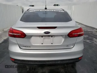 2018 Ford Focus SE z VIN 1FADP3F29JL272804, wystawiony jako Copart lot #49612625 z przebiegiem Nie podano mil oraz Czysty tytuł • Clean title. Historia ofert i sprzedaży dostępna na DreamBid. Obrazek 6.