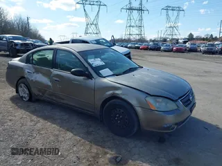 2002 Nissan Altima S with VIN 1N4AL11D92C256180, listed as a IAAI auction lot 41880101 with 112,228 mi miles. Bid and sale history available at carsss.com. Image 6.