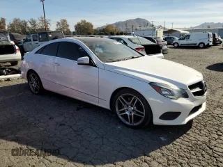 2015 Mercedes-Benz E 400 with VIN WDDKJ6FB0FF294447, listed as a Copart auction lot 84929364 with 96,689 mi miles and Salvage title. Bid and sale history available at DreamBid. Image 4.