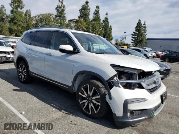 2021 Honda Pilot Elite with VIN 5FNYF6H02MB029791, listed as a Copart auction lot 42829435 with 54,403 mi miles and Salvage Title. Bid and sale history available at DreamBid. Image 4.