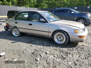 1995 Toyota Corolla DX with VIN 2T1AE09B0SC098739, listed as a Copart auction lot 57653205 with 154,226 mi miles and Salvage title. Bid and sale history available at DreamBid. Image 4.