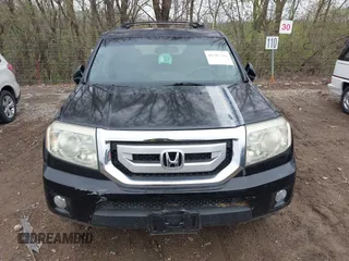 2009 Honda Pilot Touring with VIN 5FNYF48959B016978, listed as a IAAI auction lot 41947782 with 234,115 mi miles and . Bid and sale history available at carsss.com. Image 12.
