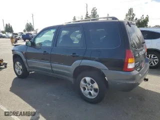 2001 Mazda Tribute LX with VIN 4F2YU09151KM38909, listed as a Copart auction lot 77808264 with 136,005 mi miles and Salvage Title. Bid and sale history available at carsss.com. Image 2.