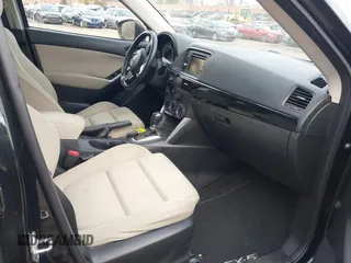 2015 Mazda CX-5 Touring with VIN JM3KE4CY2F0445178, listed as a IAAI auction lot 41828953 with 137,330 mi miles and . Bid and sale history available at DreamBid. Image 5.