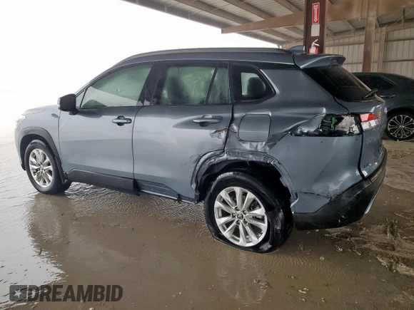 2023 Toyota Corolla Cross LE with VIN 7MUBAAAG4PV042580, listed as a Copart auction lot 63797305 with 59,576 mi miles and Salvage title. Bid and sale history available at DreamBid. Image 2.