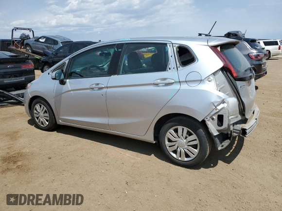 2015 Honda Fit LX with VIN 3HGGK5H59FM709104, listed as a Copart auction lot 63569065 with 101,859 mi miles and Salvage title. Bid and sale history available at DreamBid. Image 2.