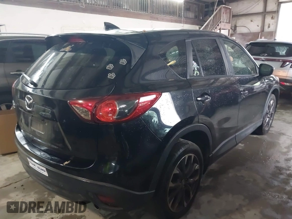 2016 Mazda CX-5 Grand Touring with VIN JM3KE4DY5G0816575, listed as a IAAI auction lot 42101340 with 180,762 mi miles and . Bid and sale history available at carsss.com. Image 4.