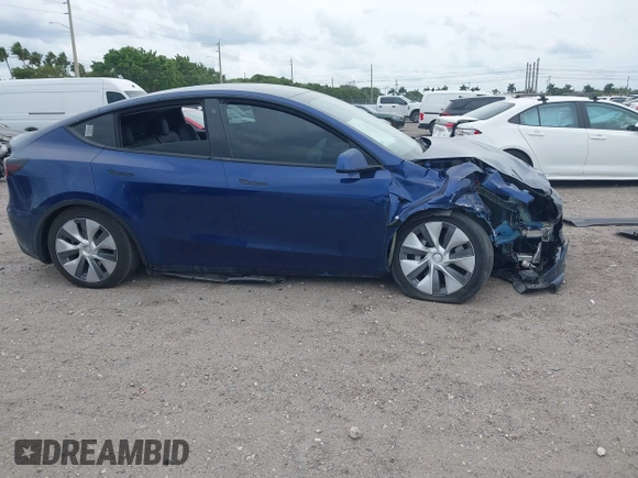 2022 Tesla Model Y Long Range z VIN 7SAYGDEE9NA002493, wystawiony jako IAAI lot #41756460 z przebiegiem 68 315 mil mil oraz . Historia ofert i sprzedaży dostępna na DreamBid. Obrazek 12.