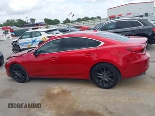 2016 Mazda 6 i Grand Touring z VIN JM1GJ1W58G1486694, wystawiony jako IAAI lot #42094443 z przebiegiem 77 803 mil mil oraz . Historia ofert i sprzedaży dostępna na DreamBid. Obrazek 14.
