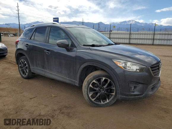 2016 Mazda CX-5 Grand Touring z VIN JM3KE4DY0G0633861, wystawiony jako Copart lot #47748645 z przebiegiem 112 219 mil mil oraz Szkoda całkowita • Salvage title. Historia ofert i sprzedaży dostępna na DreamBid. Obrazek 4.
