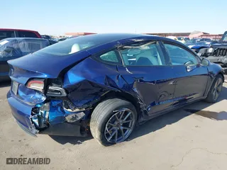 2023 Tesla Model 3 with VIN 5YJ3E1EA9PF697573, listed as a IAAI auction lot 41173833 with 6,966 mi miles. Bid and sale history available at carsss.com. Image 4.