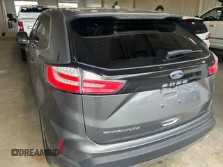 2021 Ford Edge Titanium z VIN 2FMPK3K97MBA51131, wystawiony jako IAAI lot #42529673 z przebiegiem 92 302 mil mil oraz . Historia ofert i sprzedaży dostępna na DreamBid. Obrazek 5.