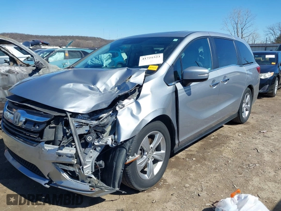 2018 Honda Odyssey EX-L with VIN 5FNRL6H71JB077112, listed as a IAAI auction lot 41721523 with 70,893 mi miles. Bid and sale history available at carsss.com. Image 2.