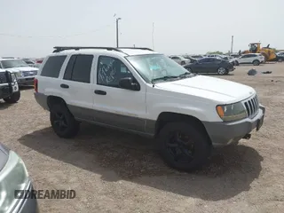 2002 Jeep Grand Cherokee with VIN 1J8GW38S62C219396, listed as a IAAI auction lot 41831930 with 196,167 mi miles and . Bid and sale history available at DreamBid. Image 1.