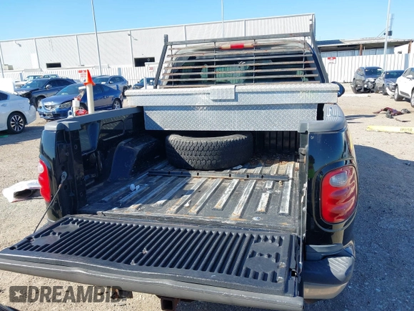 2003 Ford F-150 XLT with VIN 1FTRW07L43KB05221, listed as a IAAI auction lot 41762332 with 226,660 mi miles. Bid and sale history available at carsss.com. Image 17.