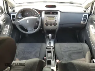 2006 Suzuki Aerio Premium z VIN JS2RC62H065351383, wystawiony jako Copart lot #82933084 z przebiegiem 80 771 mil mil oraz Tytuł czysty. Historia ofert i sprzedaży dostępna na DreamBid. Obrazek 8.