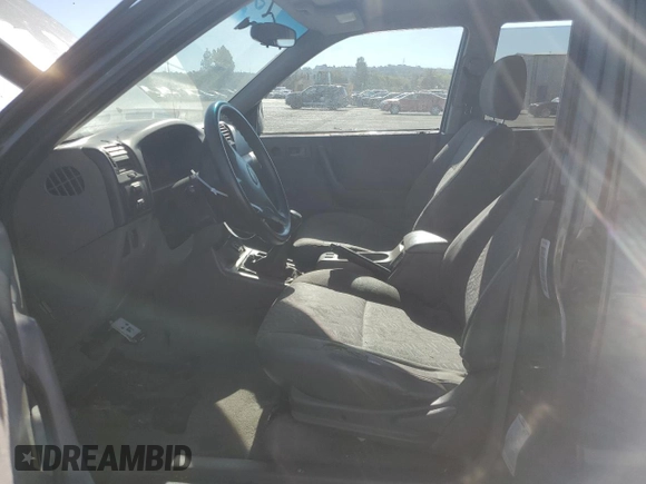 2004 Isuzu Rodeo S with VIN 4S2CK58W344303242, listed as a Copart auction lot 75339714 with 106,659 mi miles and Salvage title. Bid and sale history available at DreamBid. Image 7.