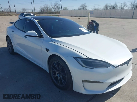 2022 Tesla Model S Plaid with VIN 5YJSA1E69NF486471, listed as a IAAI auction lot 41228818 with 49,207 mi miles and . Bid and sale history available at carsss.com. Image 1.