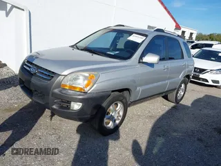 2005 Kia Sportage LX z VIN KNDJF723X57077945, wystawiony jako IAAI lot #41431249 z przebiegiem 145 334 mil mil oraz . Historia ofert i sprzedaży dostępna na DreamBid. Obrazek 2.
